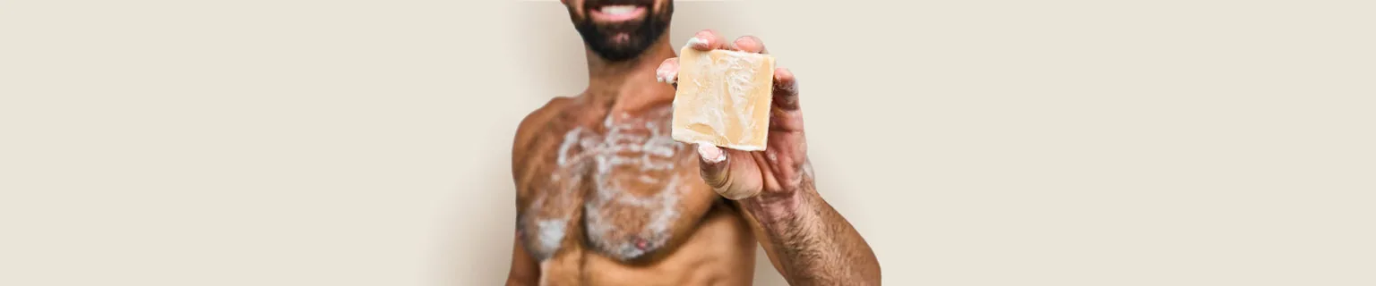 A bar of soap held toward the camera